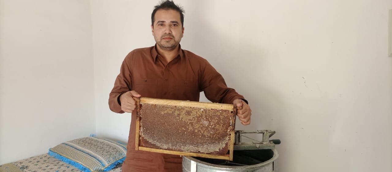 Processing & Packaging process showing sustainable beekeeping and raw honey production - Step 2